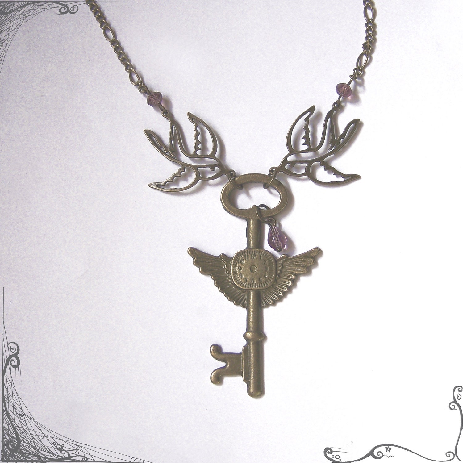 Swallow Necklace - Winged Key Pendant  - Purple crystals - Rockabilly jewelry with a victorian twist