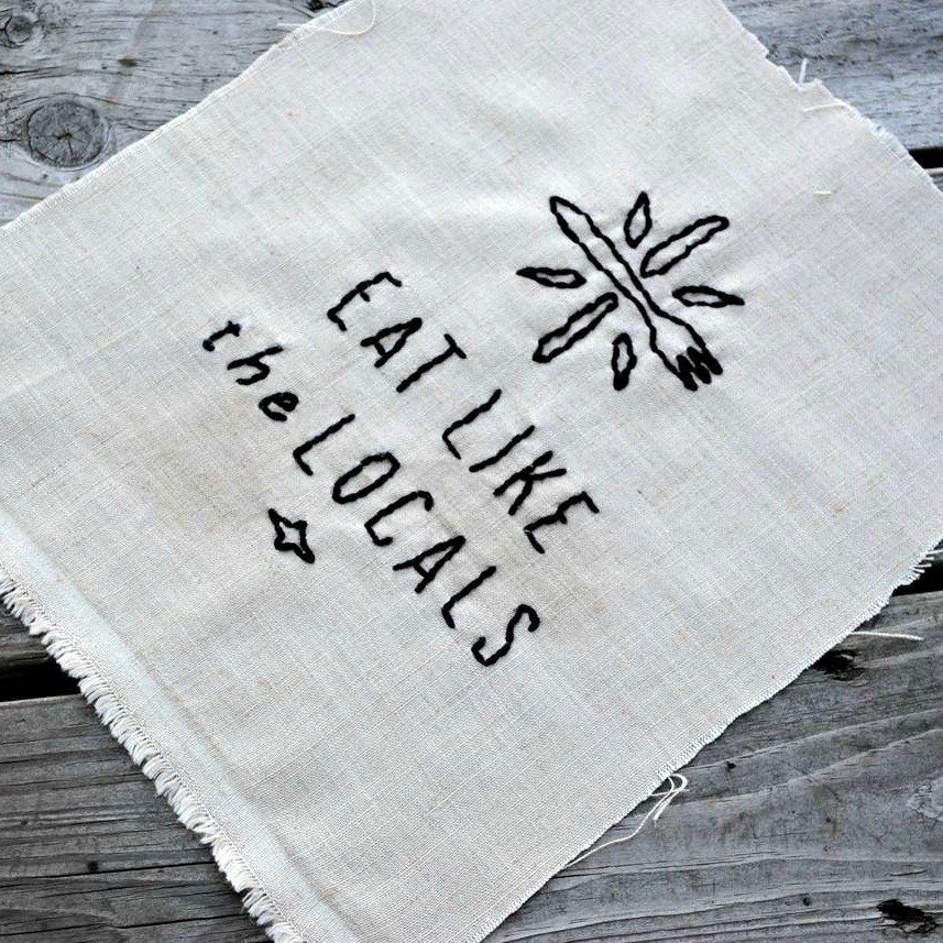 FREE SHIPPING.  an eat like the locals embroidery.
