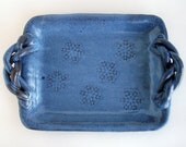 Blue serving platter with snowflake design and braided handles: ceramic pottery tray