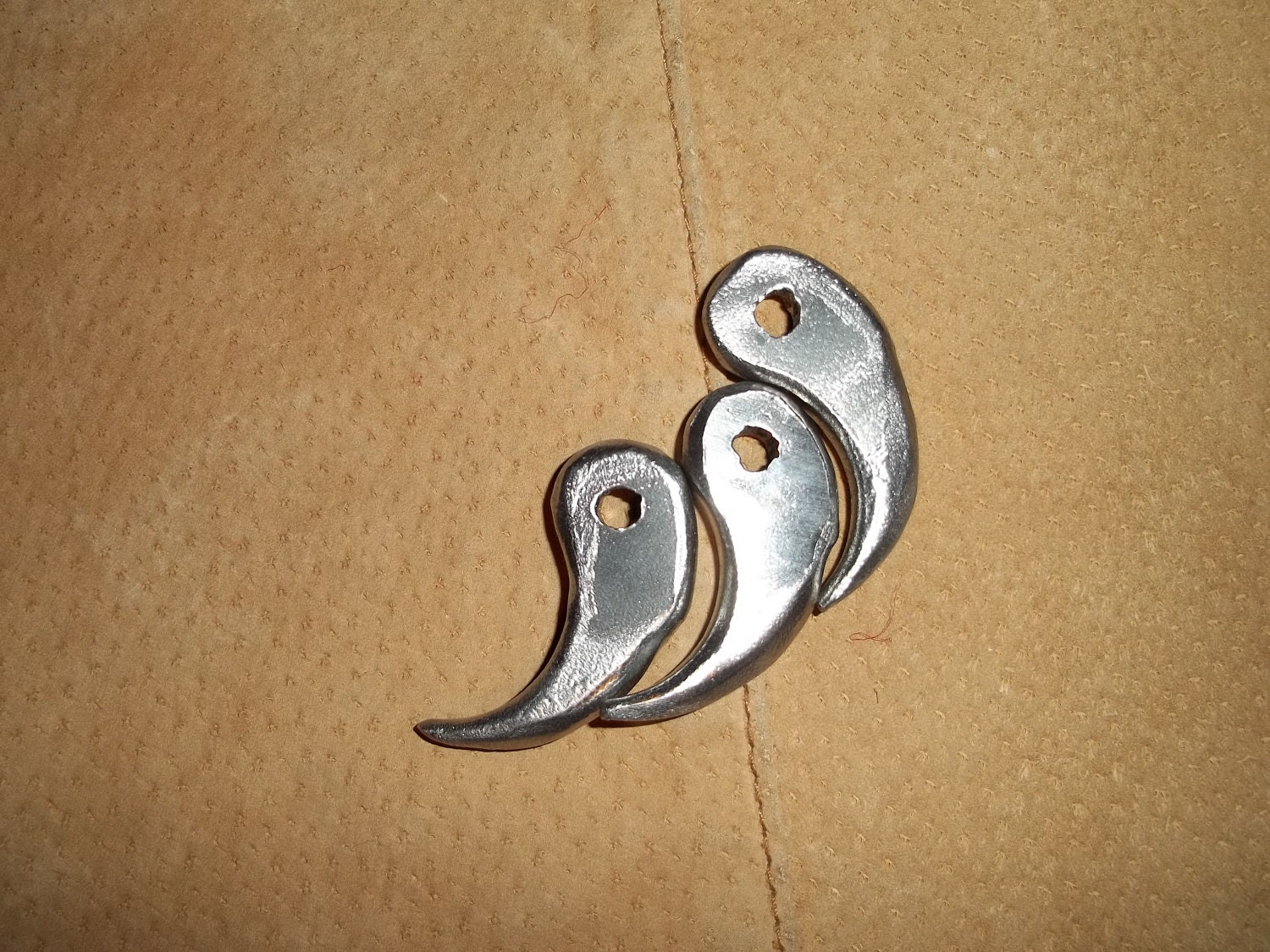Three hand forged iron claws
