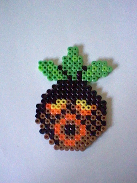 The Legend of Zelda Deku Mask  perler bead creation....melted beads with magnet on back