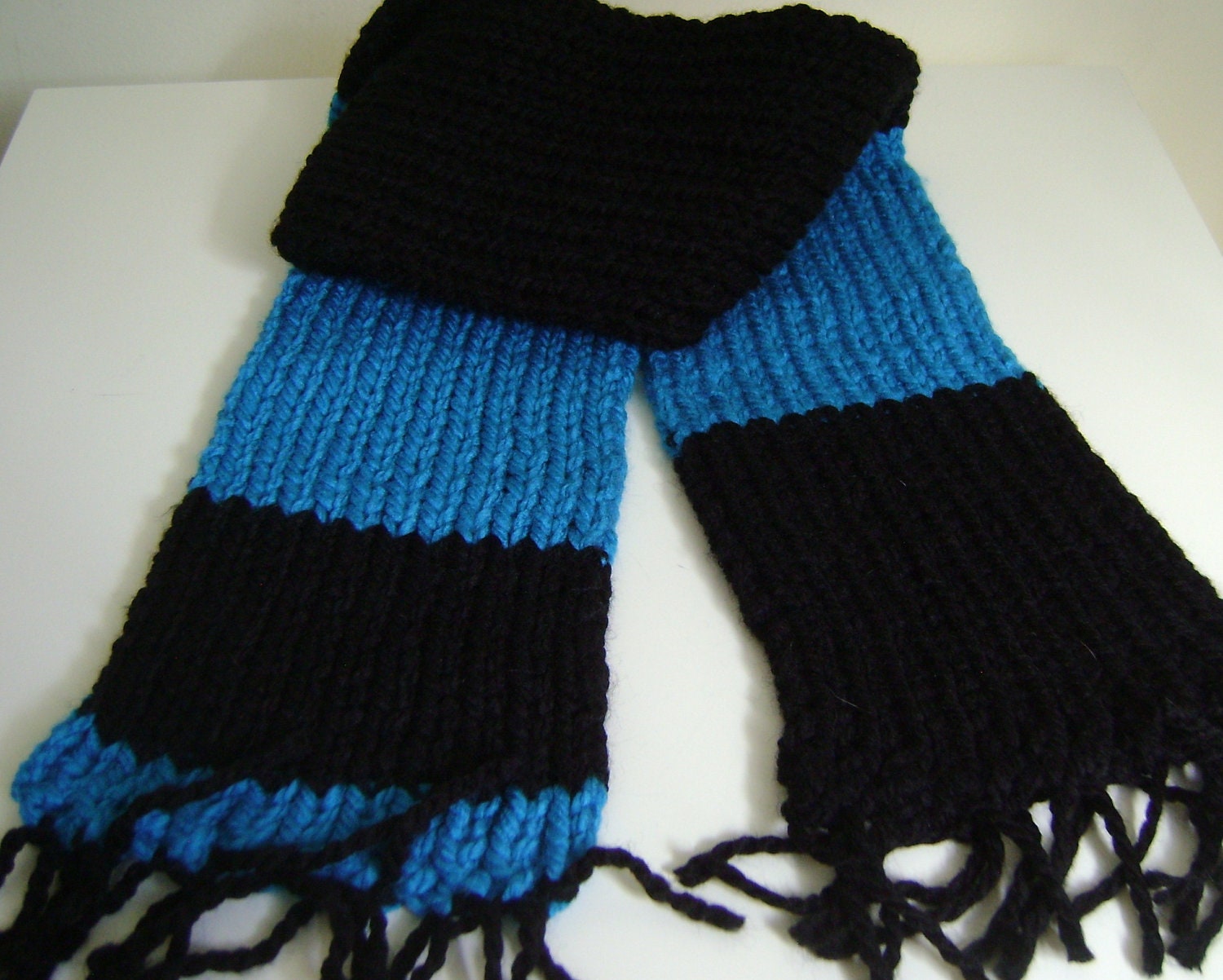 Short, soft black and bright blue scarf