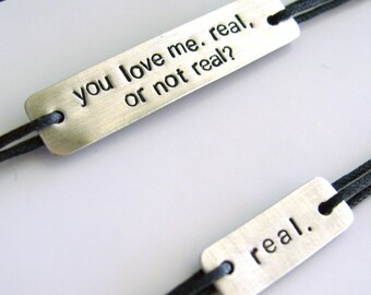 Hunger Games Bracelet Set - Katniss & Peeta: Real or not real - Stamped Metal Wrap Bracelets on Cotton Cord