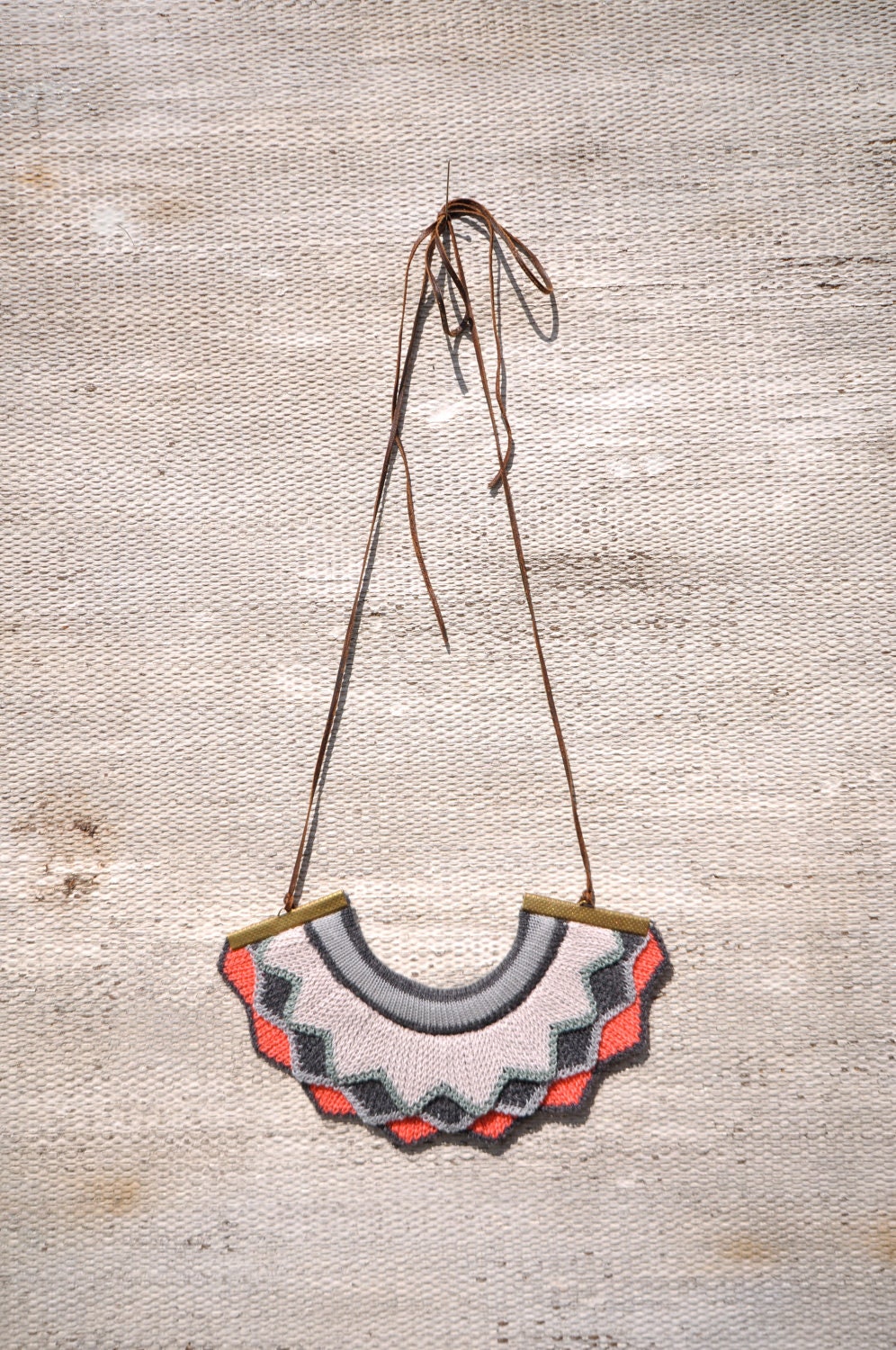 Harlequin knitted necklace - Bright Coral