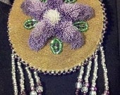 Tufted Purple Flower Barrette, made of Caribou Hair, on moose hide with beads.