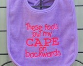 Purple Pink Bib These Fools Put My Cape on Backwards