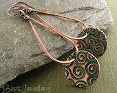 Antiqued copper earrings featuring teardrop loops dangled with a copper clay charm with turquoise spirals