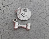 1 paw print charm plus 1 silver dog bone charm, add a sterling silver stamped initals charm, pendant teamepe