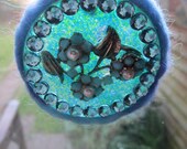 resin window decor sun catcher blue and green speckles with vintage flower jewelry blue wool and blue sparkly gems