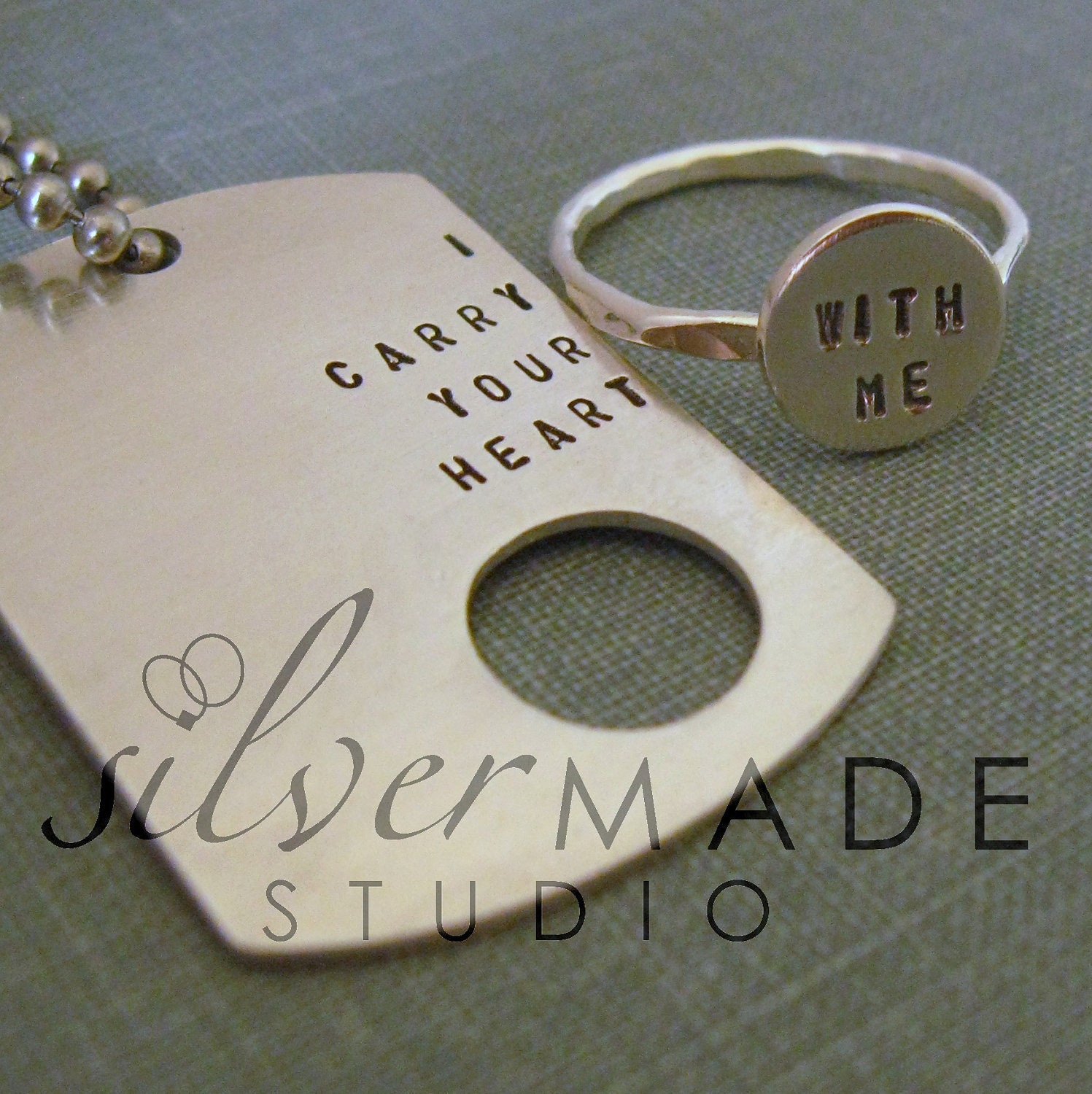 i carry your heart  dog tag and sterling silver ring. Intertwine