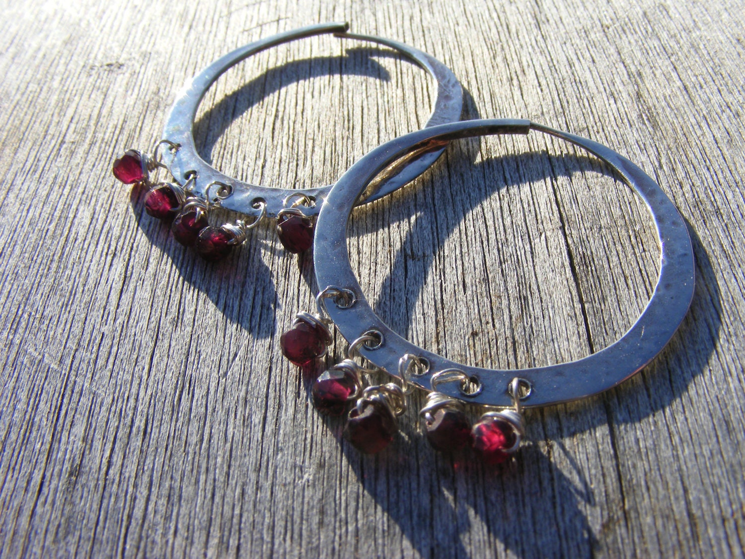 Hang the Moon. Sterling Silver Hammered Hoops With Garnets