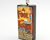 Fools Fortune pendant on upcycled domino