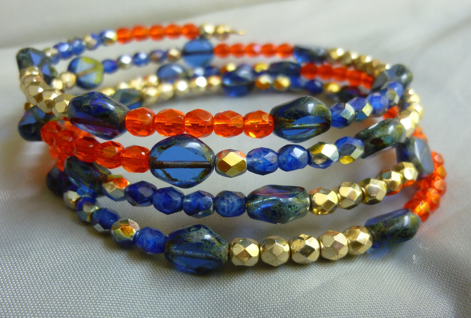 Gold plated memory wire tangerine and navy color block bracelet
