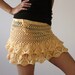 Crochet beach mini skirt in peachy cotton