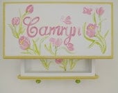 A beautiful handpainted jewelry box with pink butterflies and tulips with a touch of pale yellow and lime green