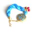 Turquoise silk bracelet with pink jade ,pearl and gold plated metal