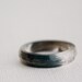 thin multifaceted eco resin ring with blue macaw feathers - size 8