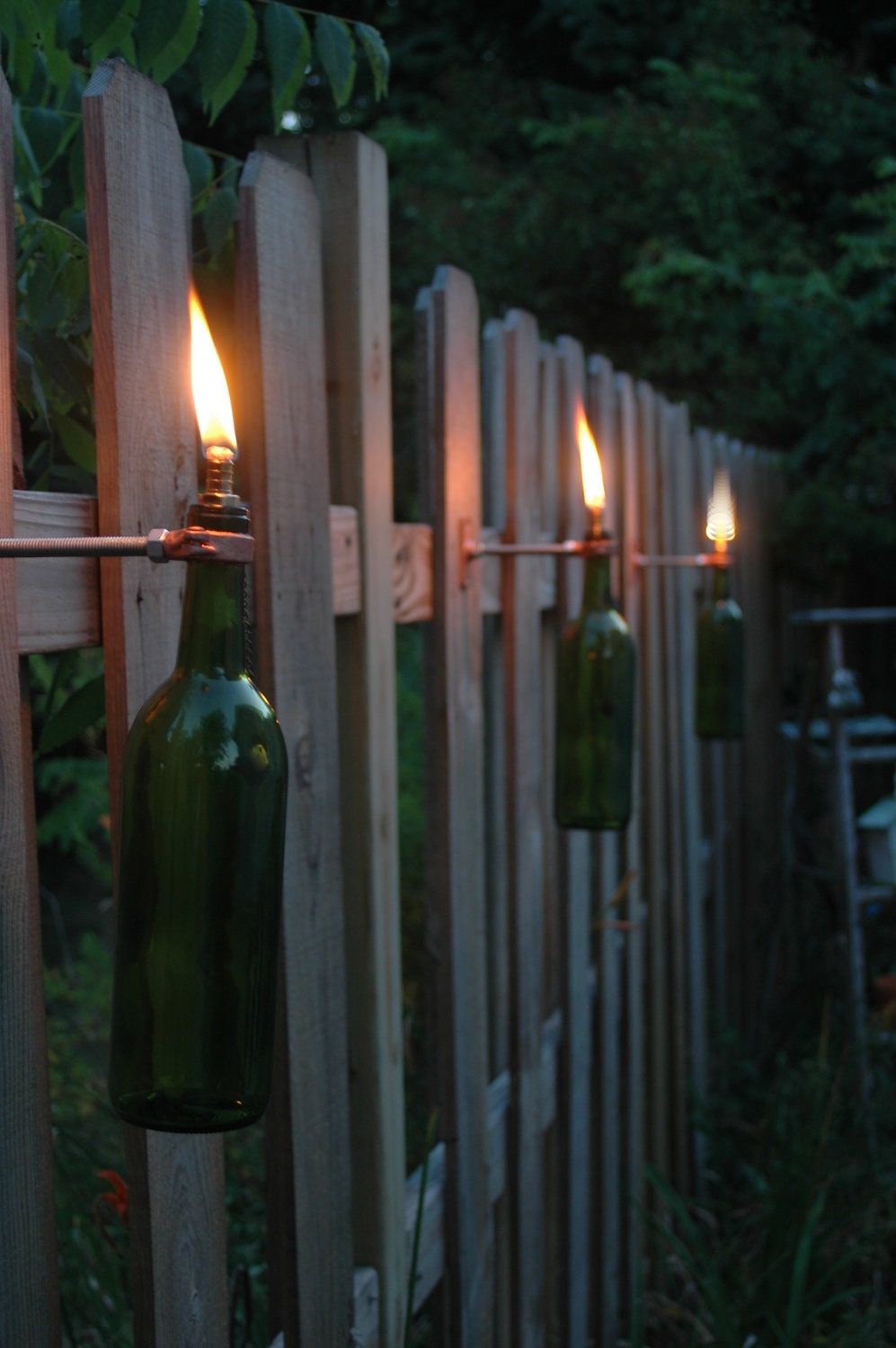 6 Wine Bottle Tiki Torches in your color choice of Red, Cobalt Blue, Frosted White, Green or Amber