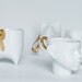Swimming in gold - Ceramic Porcelain figurine, for olympic and sport lovers.