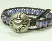Leather wrap bracelet, gorgeous purple and lavender beads on distressed gray leather, with winged heart closure. Rocker, glam look.