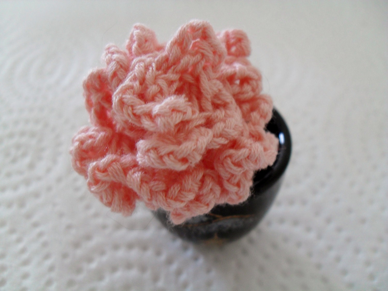 Small pink knitted carnation / rose