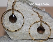 Smokey Quartz brios suspended within Golden Hoops
