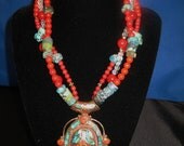 Turquoise tribal style necklace. Red coral with turqouise and citrine beads