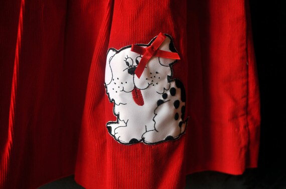 Two piece set, red corduroy dress, with puppy, and matching black and white polka dotted shirt, size 4T