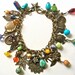 Antiqued brass charm bracelet/necklace with nature theme & vintage beads, crystals, turquoise, trade beads charms, filigree....