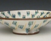 shallow fruit bowl with blue green rectangles