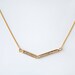 Geometric cubic v necklace