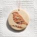 Little bird hanging. Stoneware.