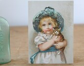 antique 1900s advertising trade card / child and kitten / Durkee's Chili Sauce, NY  / girl with cat, in teal bonnet and sash