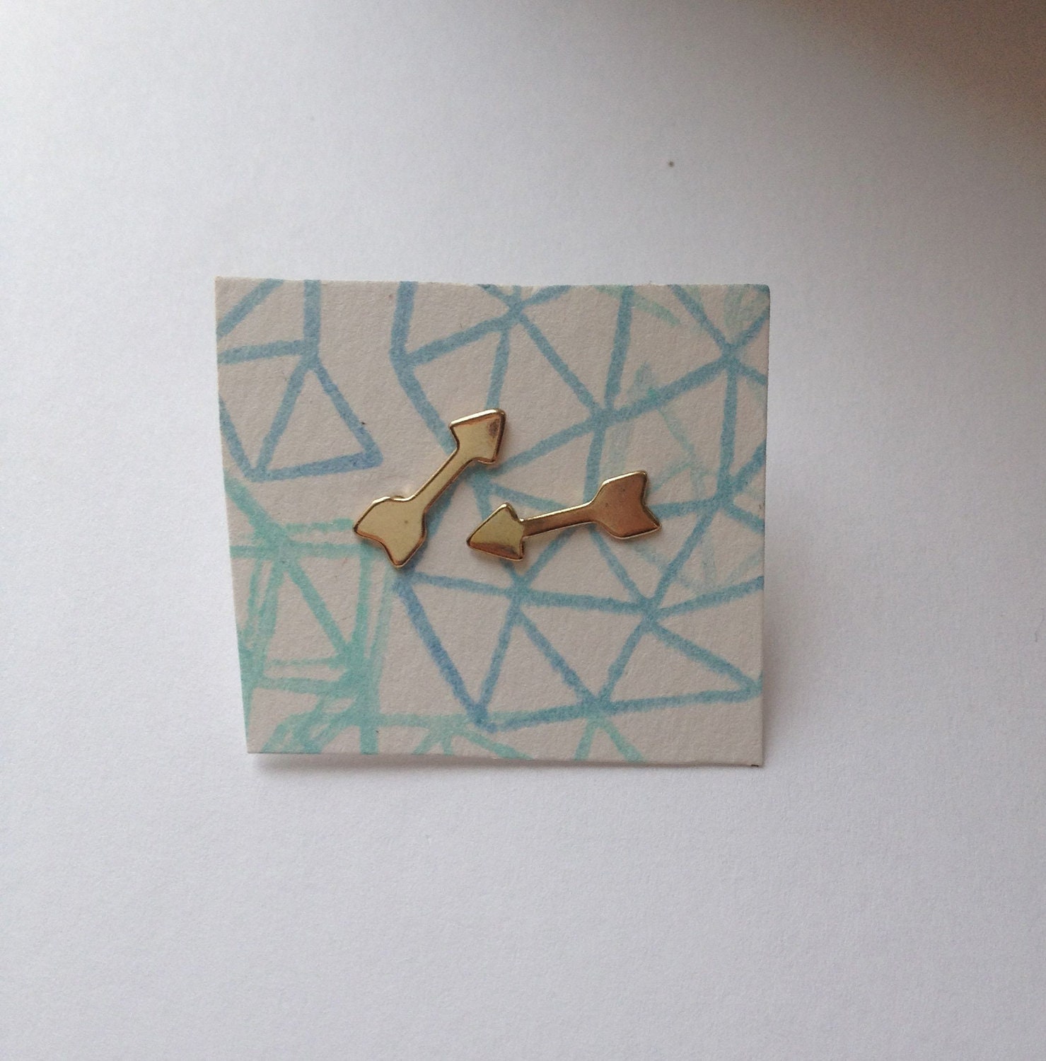 Tiny brass arrow stud earrings