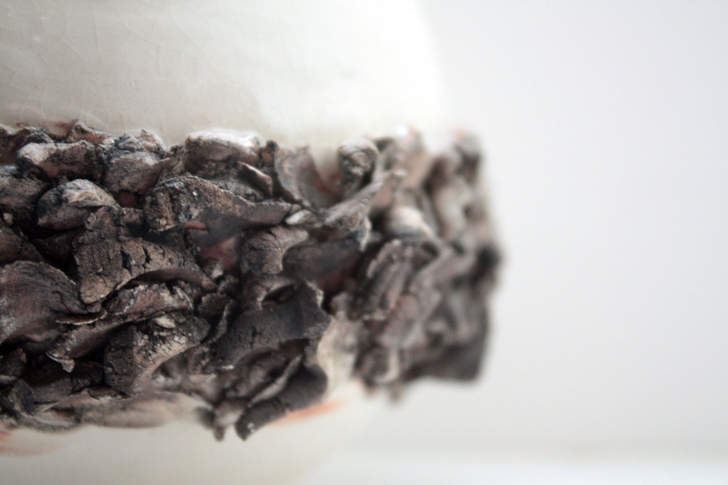 Ceramic sphere vase with white stoneware and red sanded clay.