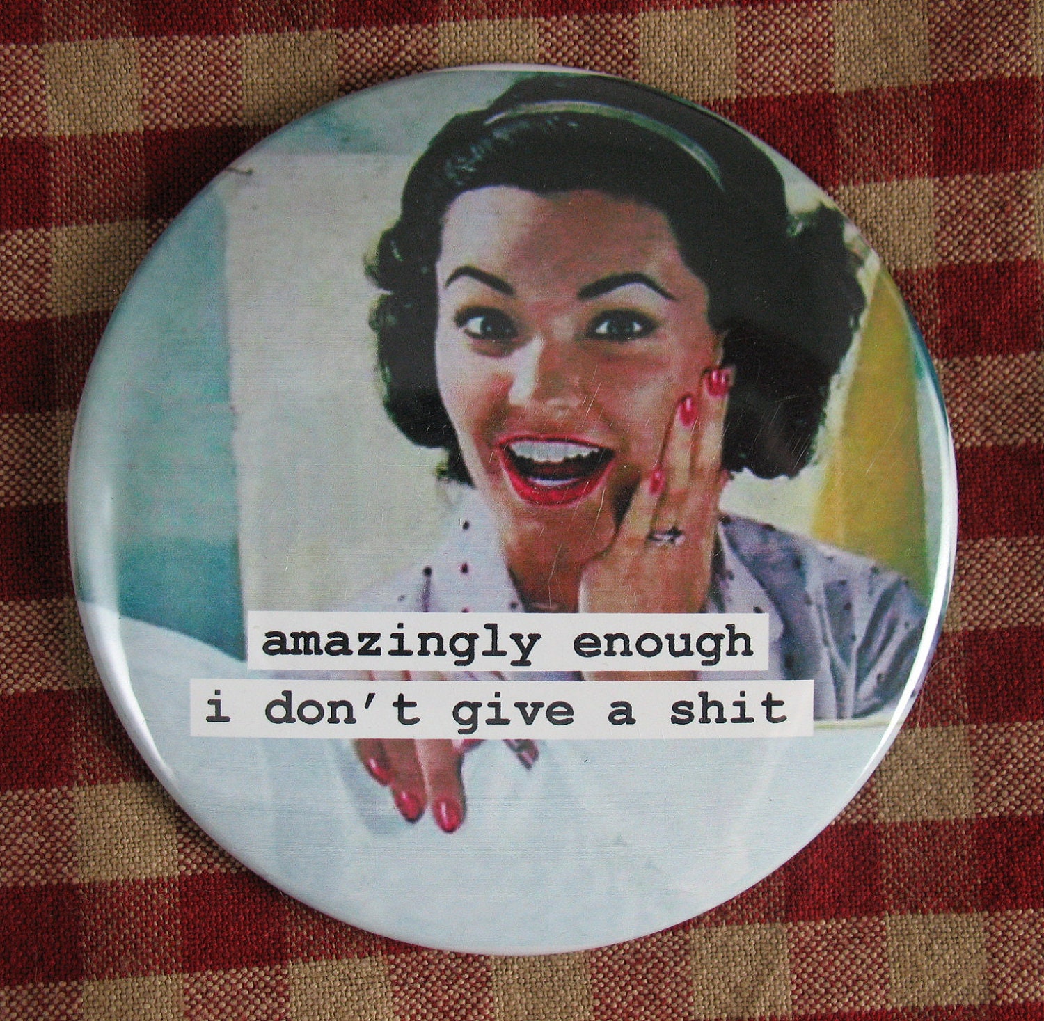 Funny Housewife Magnet. Amazingly enough  3 inch mylar