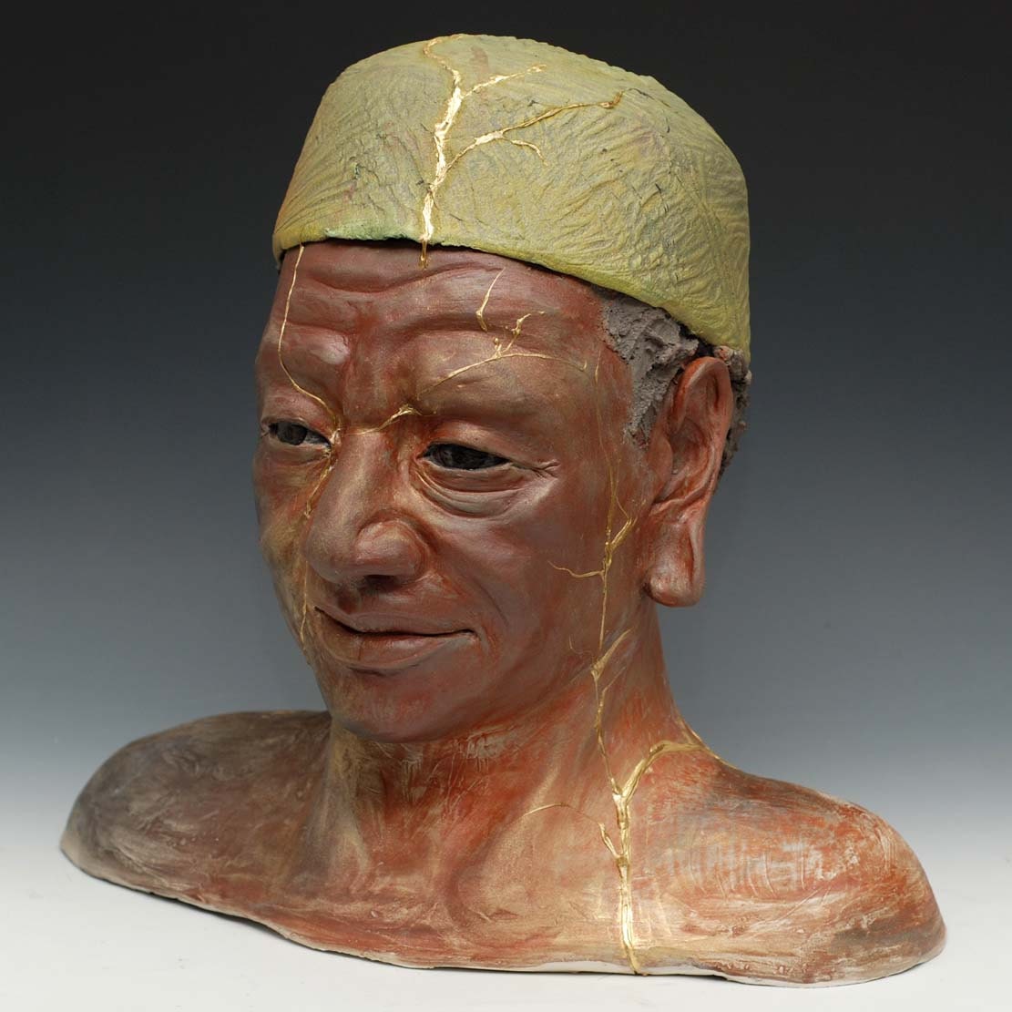 African Buddha Sculpture With a Sea Green Cap
