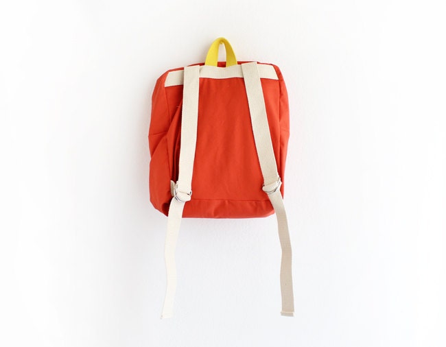 orange backpack with magenta pouch