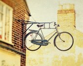 Bike photo bicycle shop Oxford British cycling team gold medal biking rusty yellow ochre Great Britain bikers man cave anorak