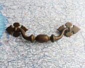 Vintage curvy distressed brass metal pull handle includes hardware