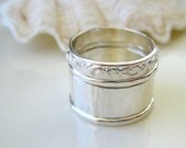 Sterling silver stacking ring set with scrolling leaf pattern and hammered textures, made to order