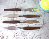 vintage. mid century modern. teak handle. set of four knives. knife. dining.