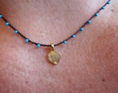 Mini Spiral Disk Charm on daintiest crocheted beaded necklace with turquoise blue and brown strand
