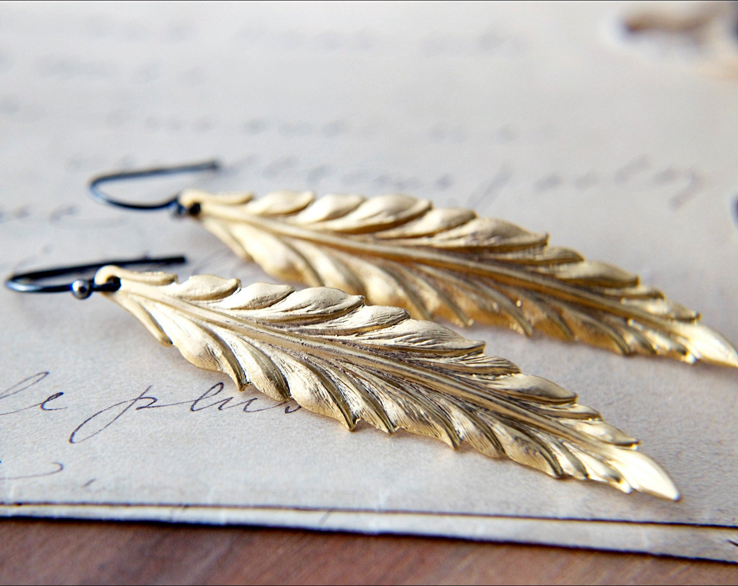 Gilded Feather Earrings Dangle Golden Natural History PoleStar