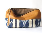 on sale.  12-inch Zipper Pouch: eco leather and hand woven blue and white ikat fabric