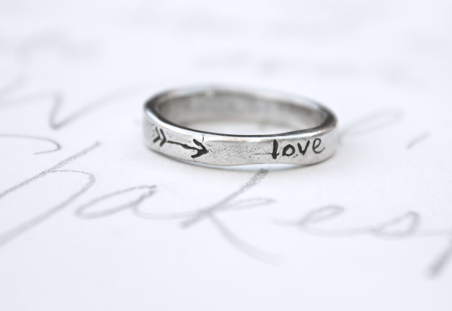 skinny silver wedding ring with arrow . recycled silver wedding band . love heart ring . silver stacking band by peacesofindigo