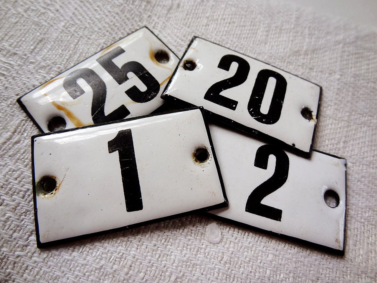 vintage enamel number 25 from Germany, likely used for hotel or apartments, black on white