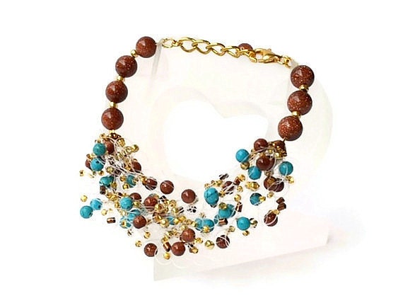 Airy crochet bracelet with turquoise and goldstone blue and brown country style