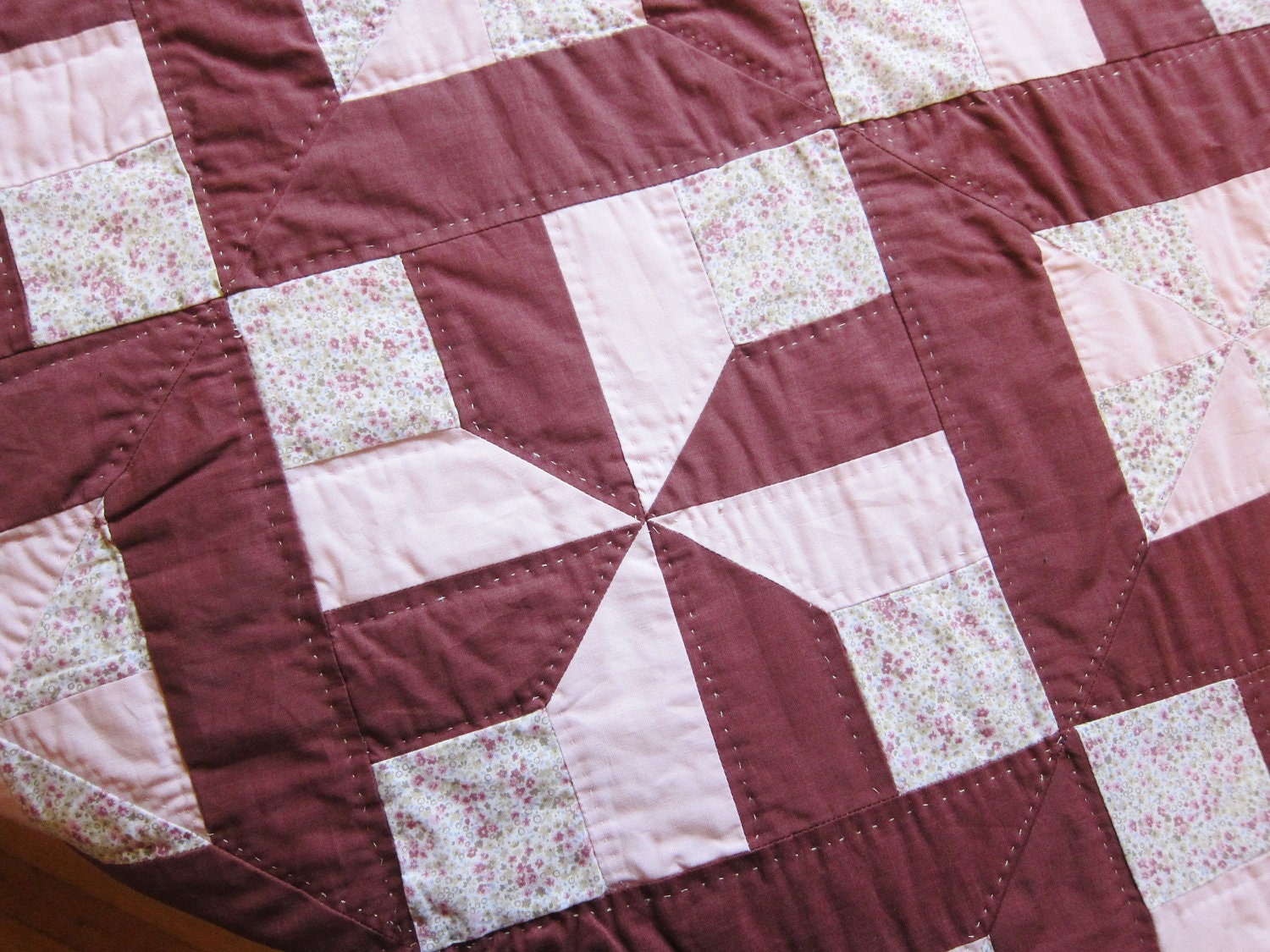 Homemade patchwork quilt 1970s russet and pink pinwheel