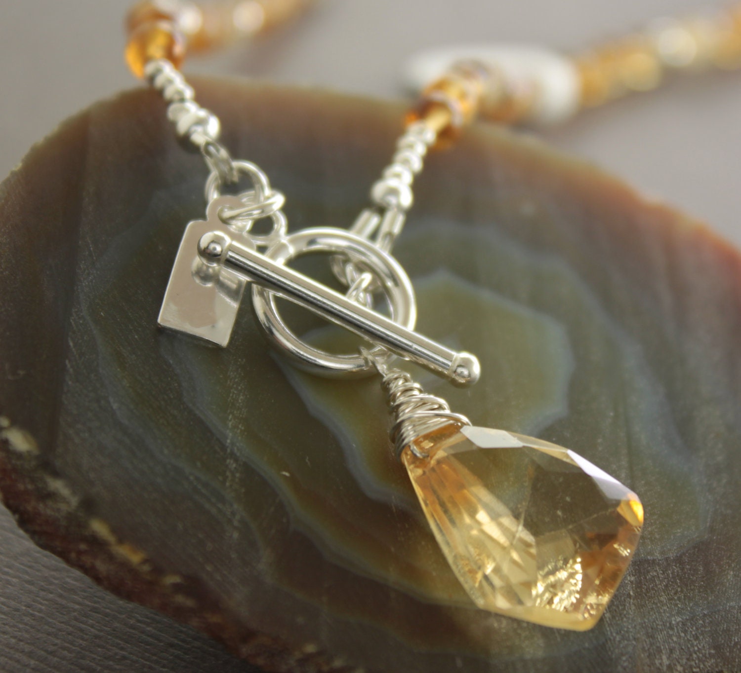 Sterling silver beaded yellow citrine strand necklace with toggle clasp front closure and faceted citrine pendant